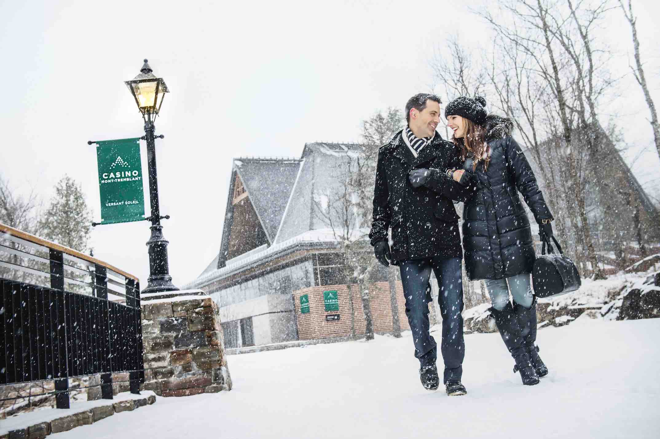 Mountain Casino with couple walking in the snow