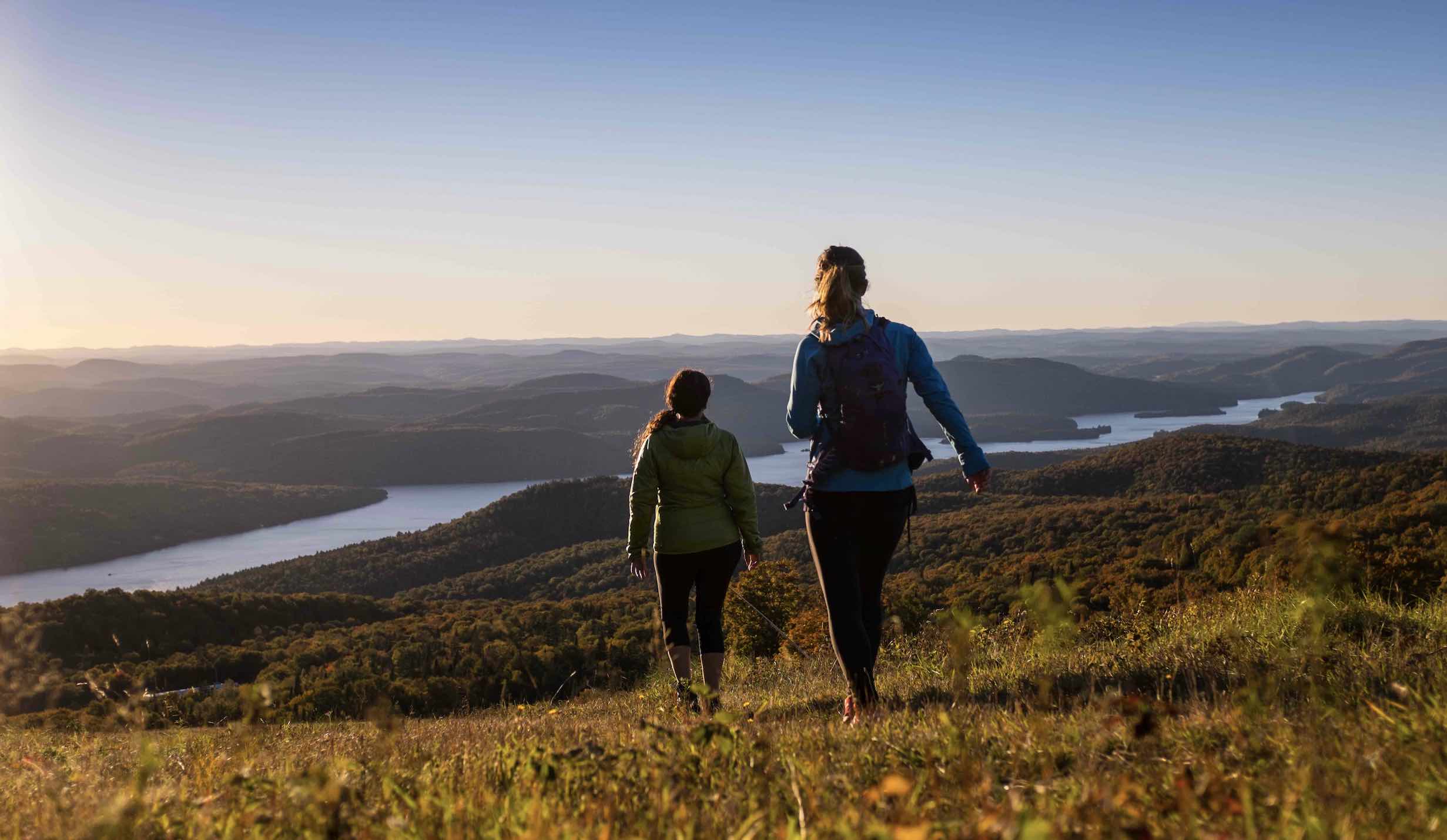 Things to do in Mont-Tremblant in summer include hiking, with 2 women looking over hills